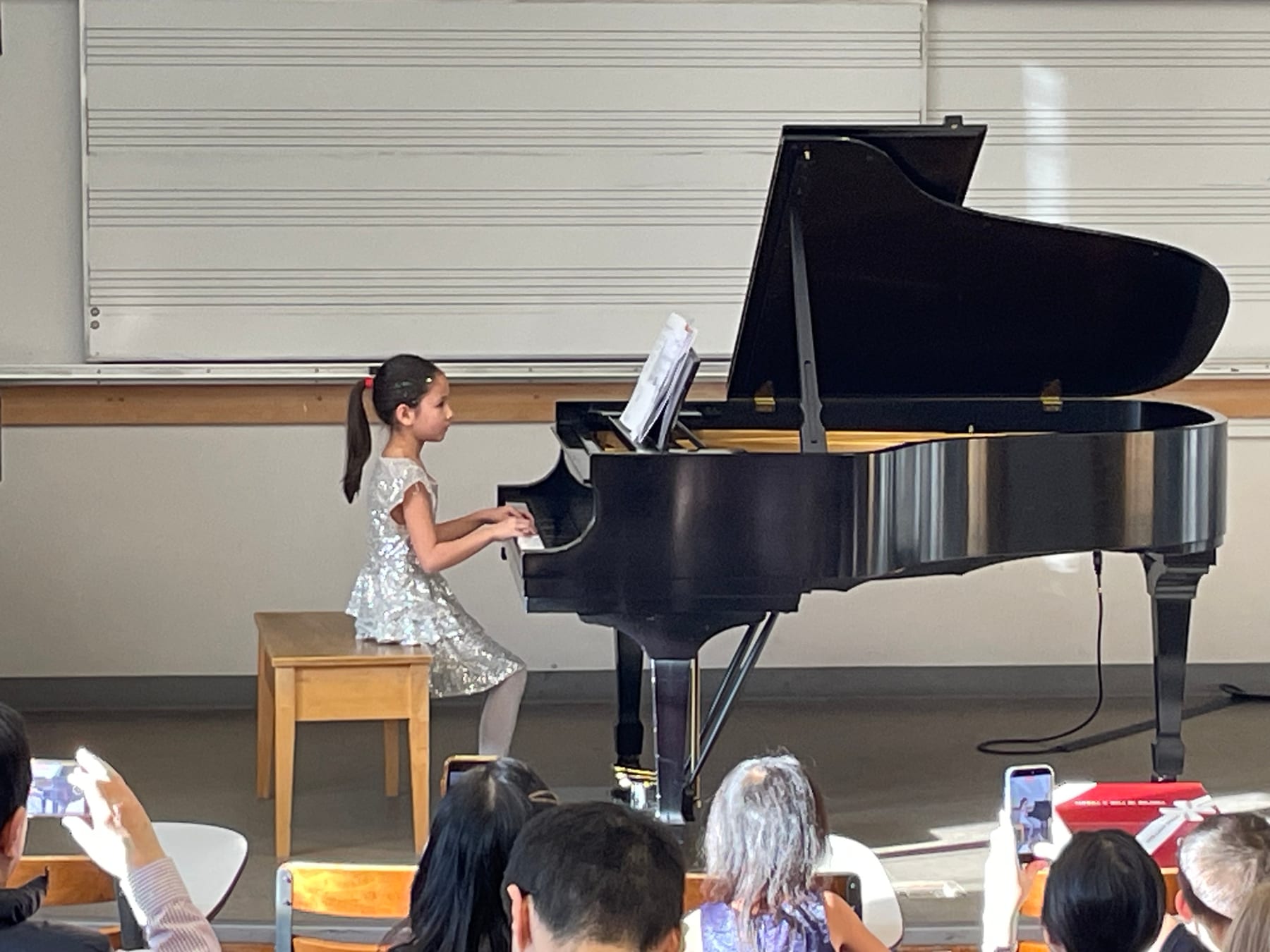 A young pianist performing at the Winter Studio Recital