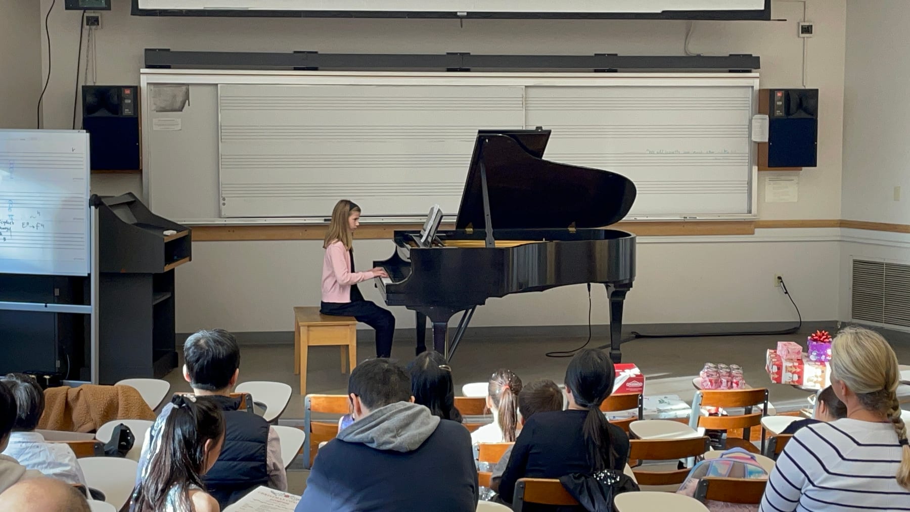 A student performing for families at the Winter Studio Recital