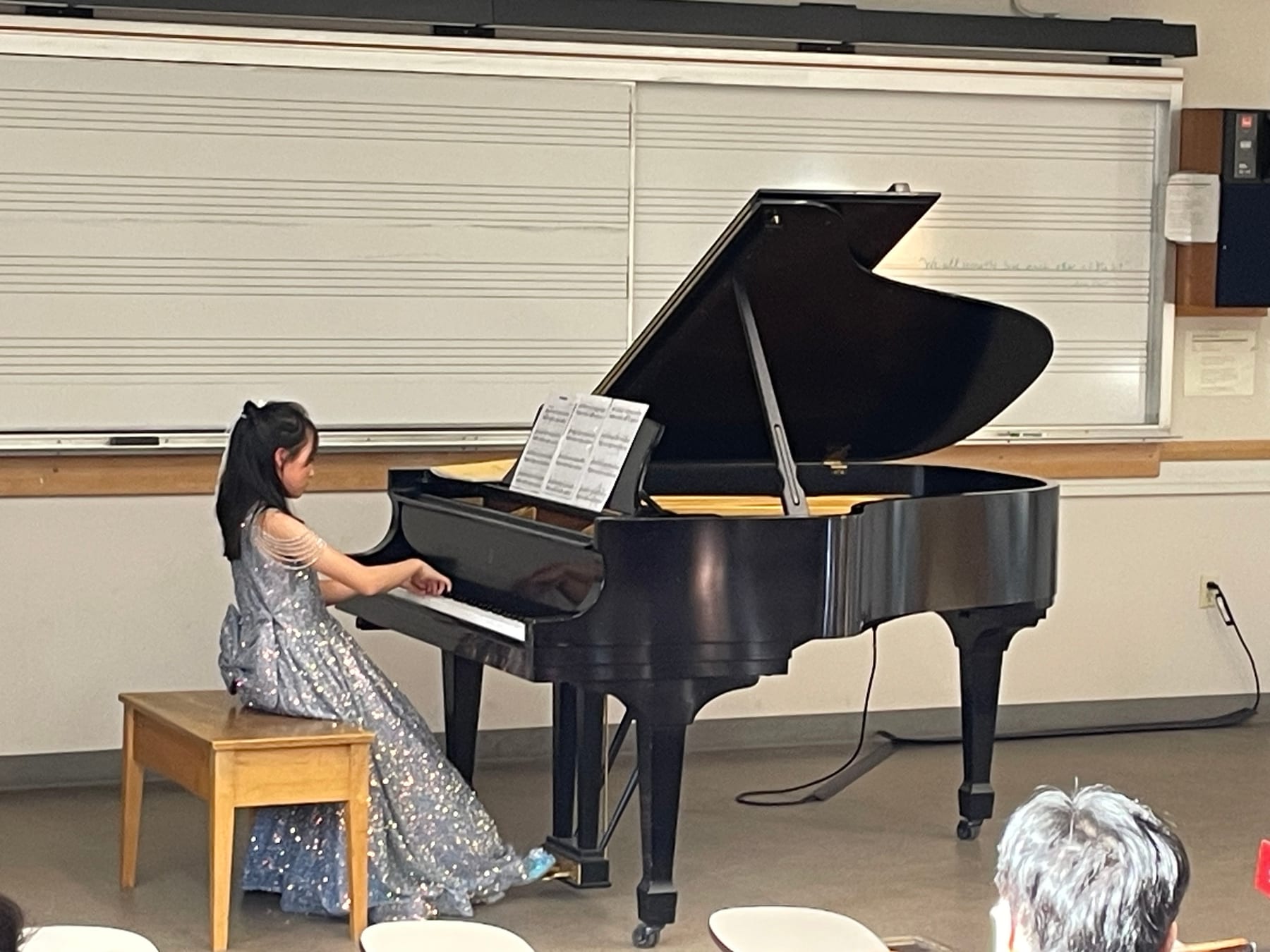 A student in concert dress performing at the Winter Studio Recital