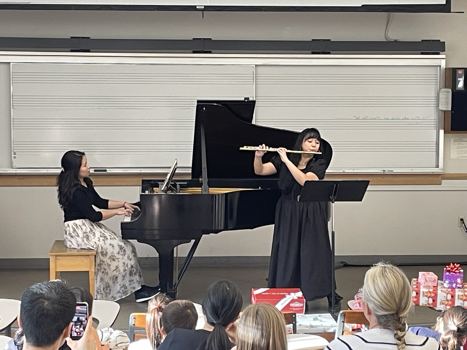 A flutist and Chiao-Yu Wu performing together at the Winter Studio Recital