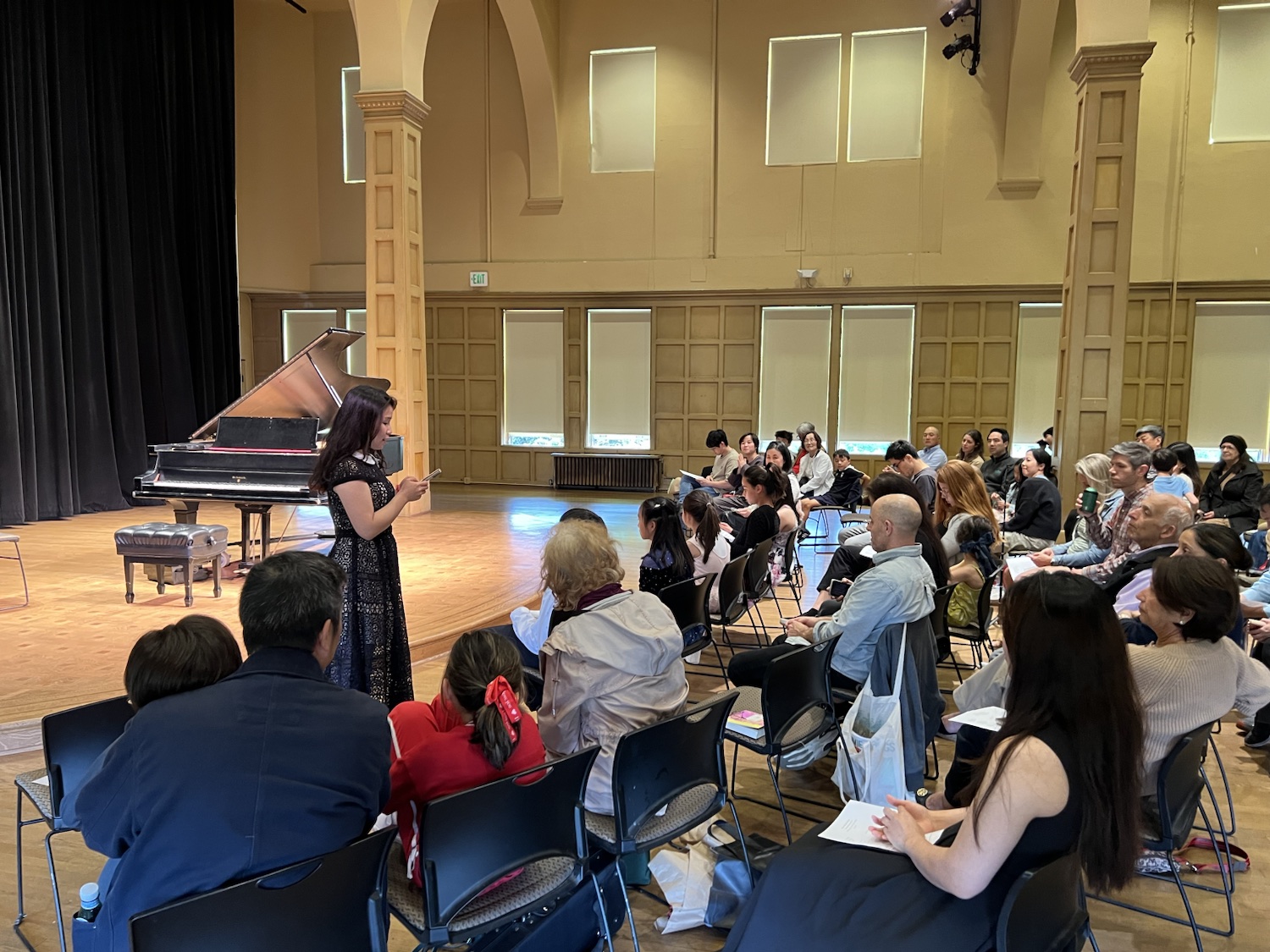 Chiao-Yu Wu welcoming families at the 2026 Spring Studio Recital