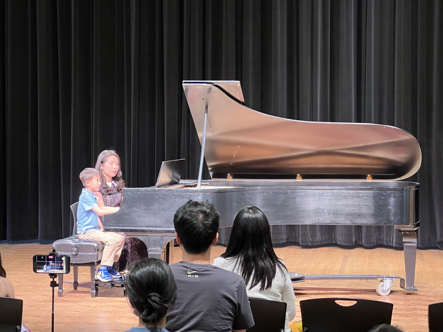 A young pianist sharing the bench with Chiao-Yu Wu