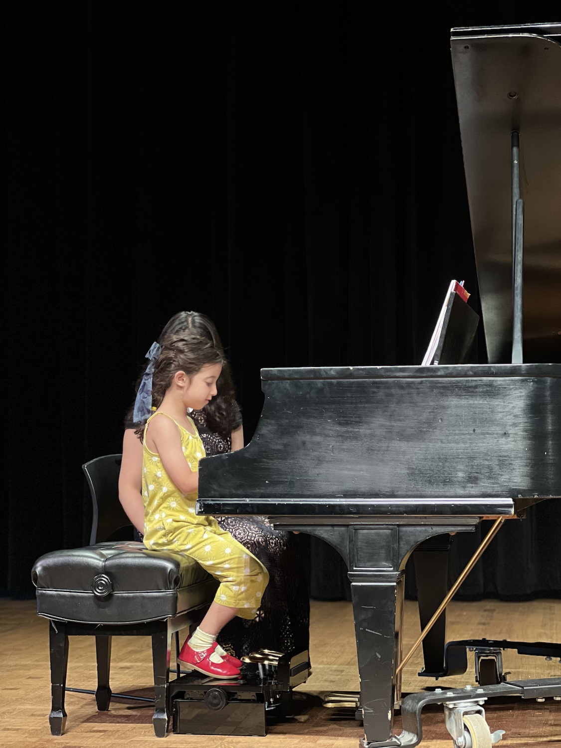 A young student performing at the 2026 Spring Studio Recital