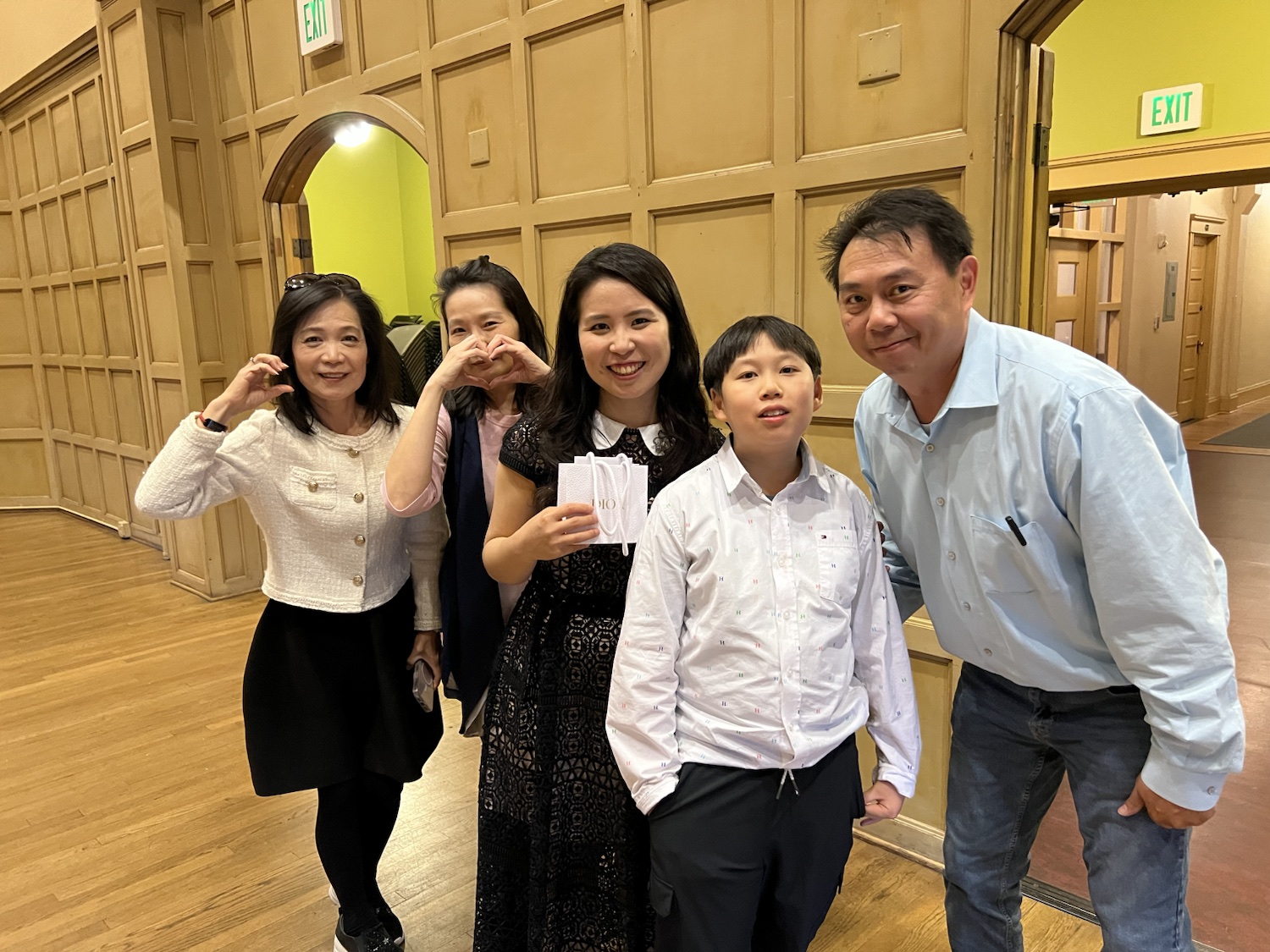 Chiao-Yu Wu celebrating with a student and family