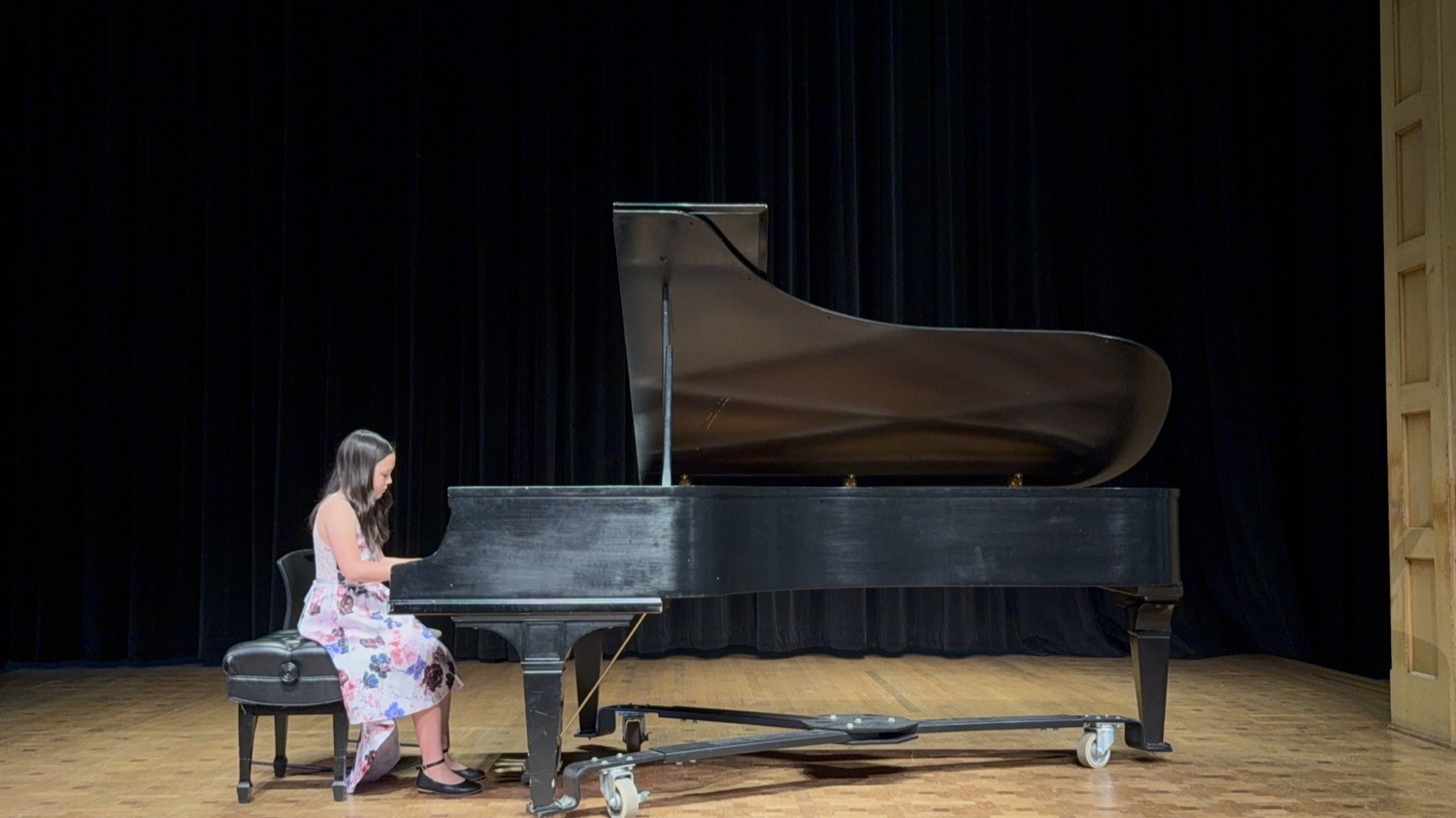 A student performing a solo piano piece