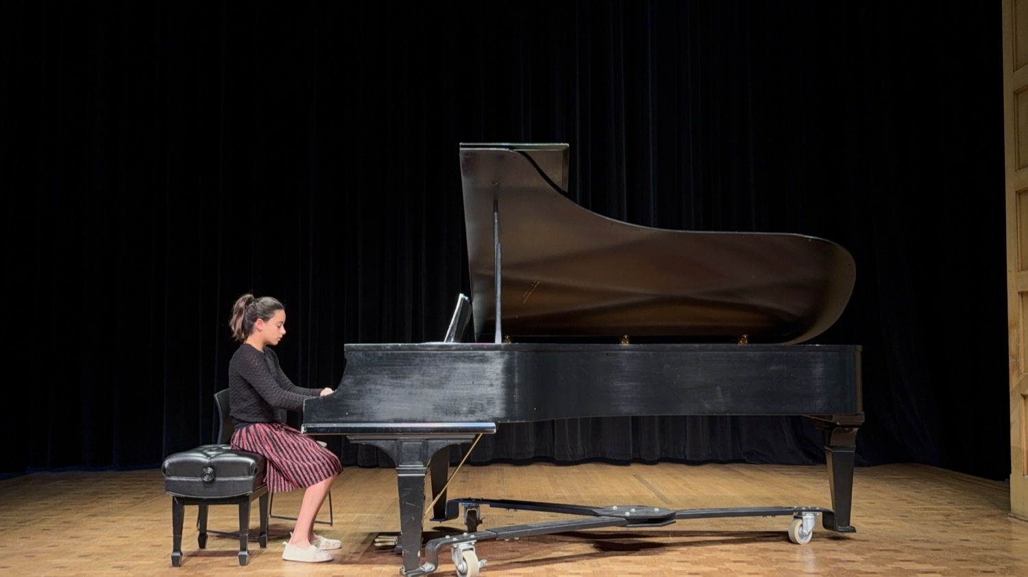 A student performing at the 2026 studio recital