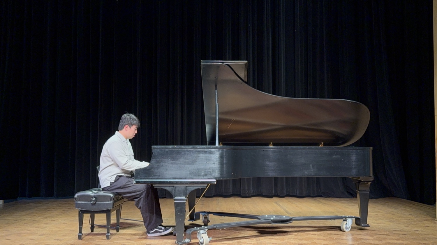 An adult student performing at the Spring Studio Recital
