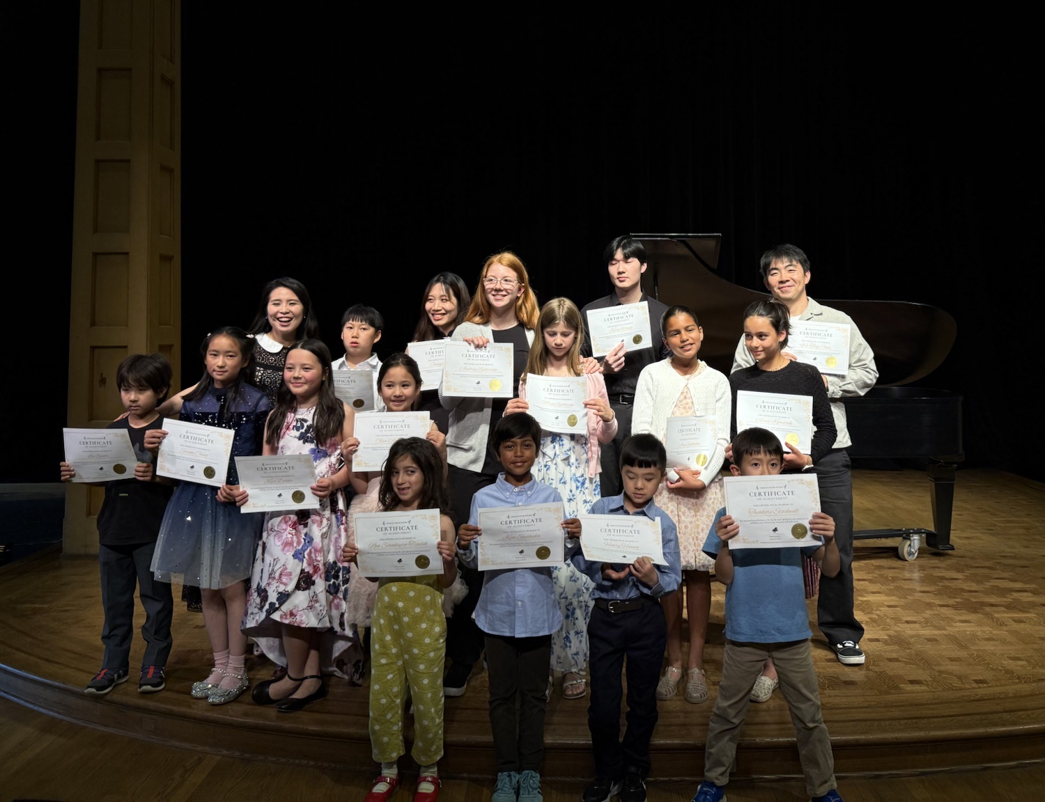 Studio students holding certificates after the recital