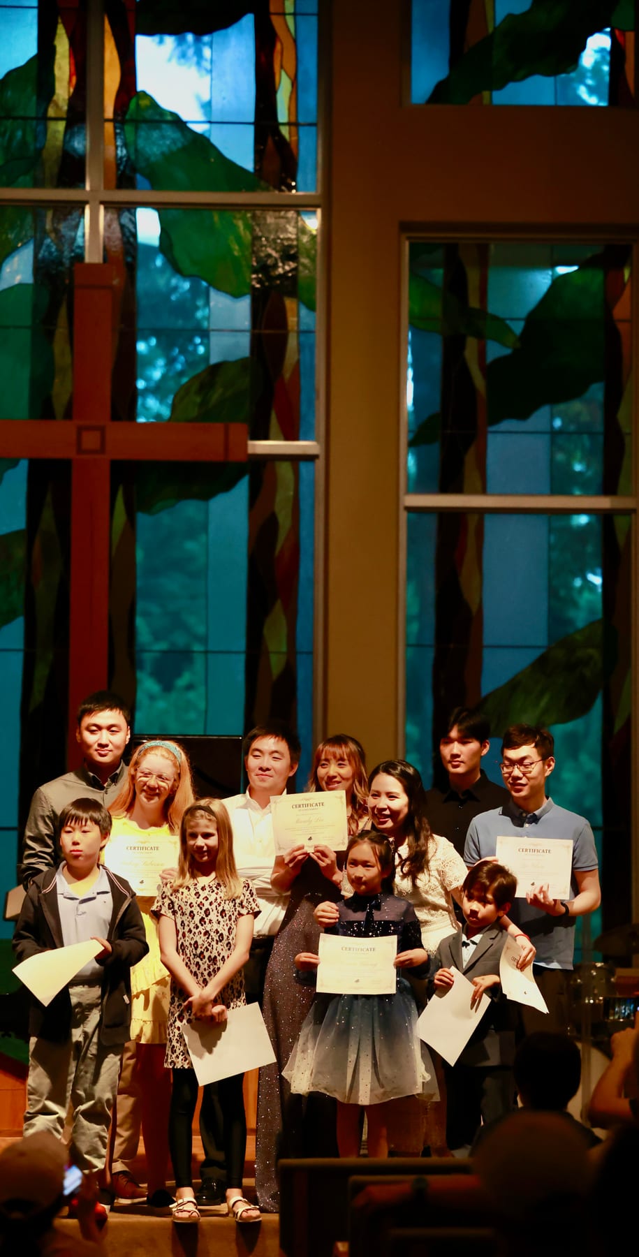 Spring Studio Recital students holding their certificates