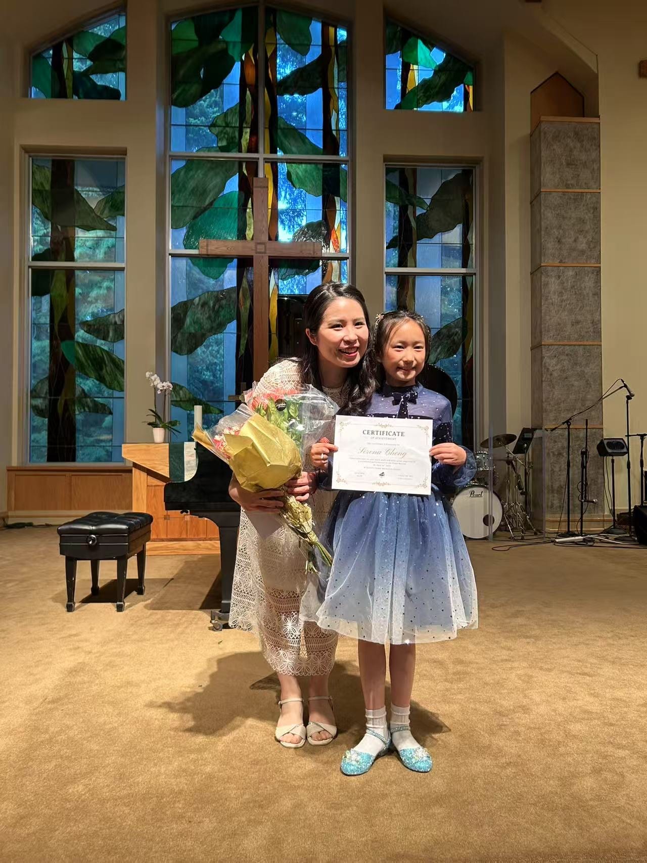 Chiao-Yu Wu with a student and flowers after the recital